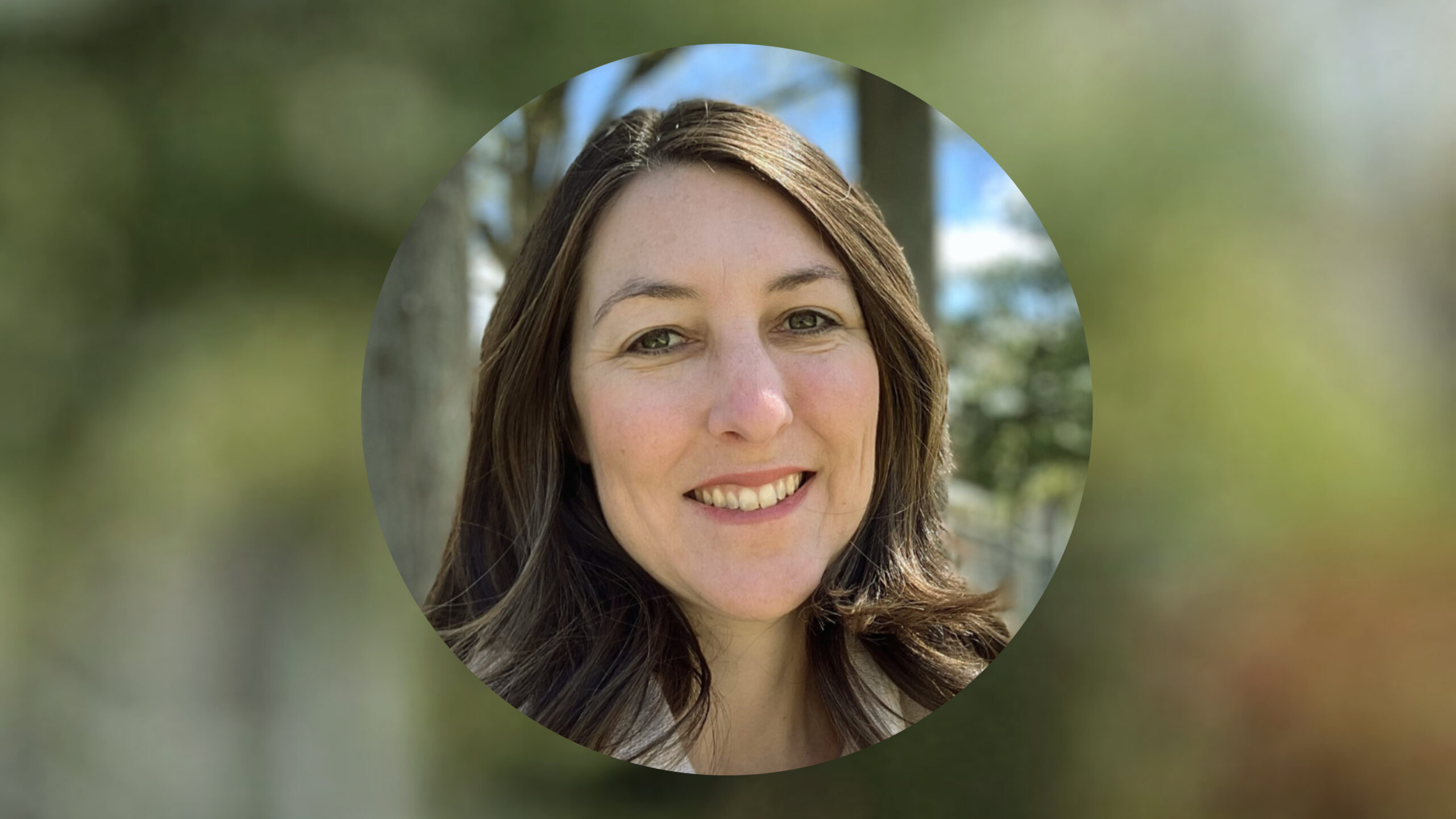 Headshot of Lauren Savage, smiling outdoors